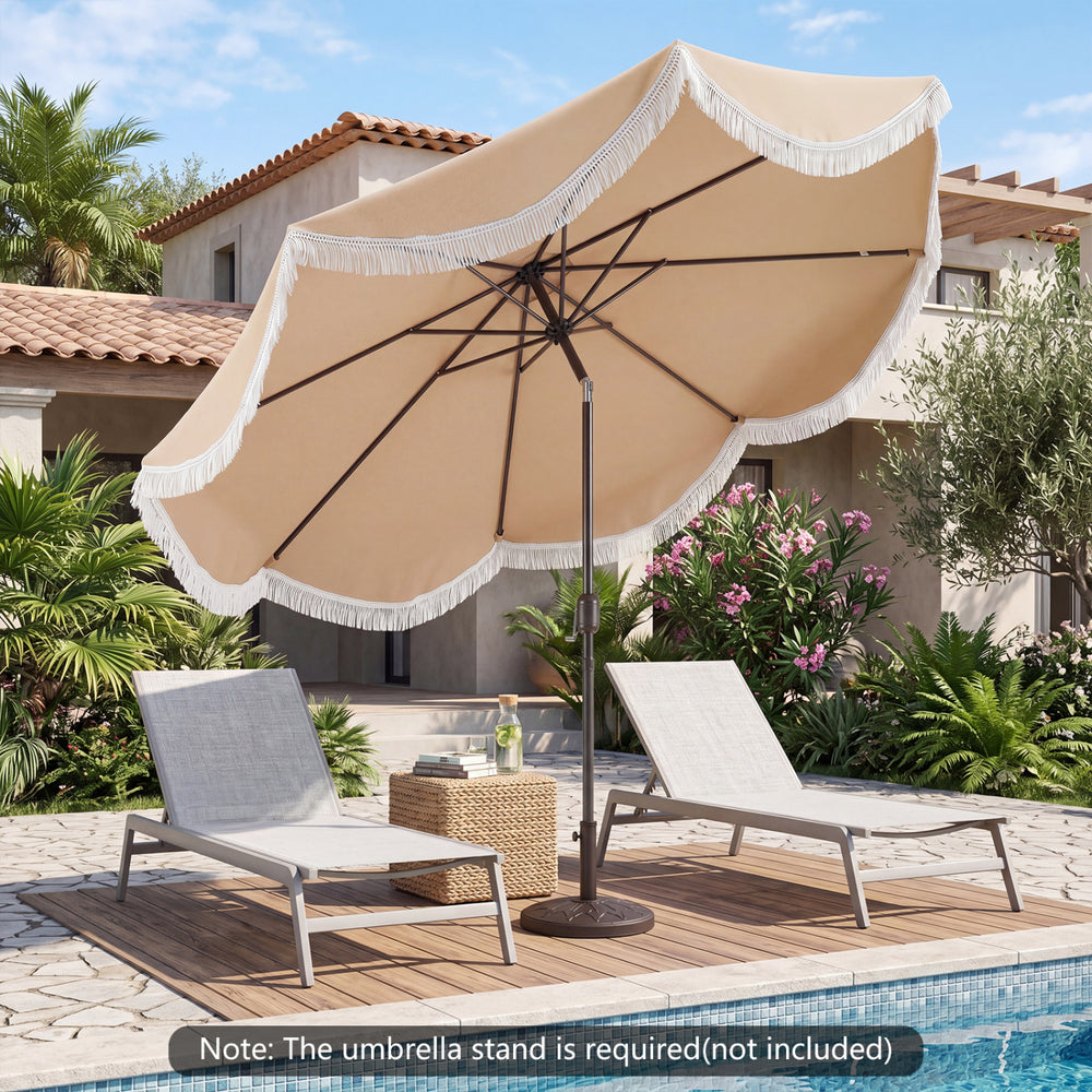 Outdoor tassel umbrella with push button tilt in white, set beside lounge chairs on a patio by the pool.