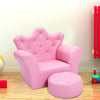 Pink kids sofa with armrests and matching ottoman, perfect for reading or relaxing in a children's room.