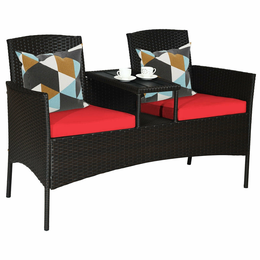 Modern patio conversation set featuring a built-in trapezoid coffee table, red cushions, and durable rattan for outdoor.