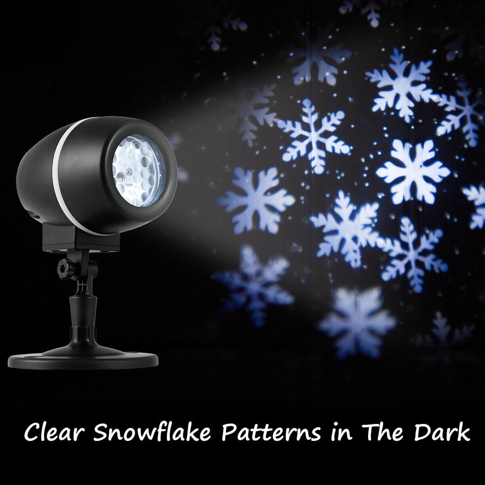 Outdoor waterproof Christmas snowflake LED projector light creating clear snowflake patterns, ideal for festive.