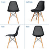 Black plastic hollow chair with beech wood legs, showcasing ergonomic design and modern style for dining or office use.