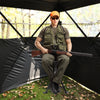 Swivel hunting chair with detachable backrest, sturdy steel frame, and adjustable legs for stable seating on any.