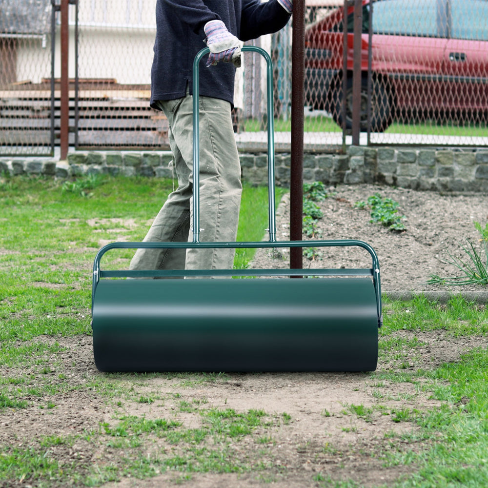 Lawn roller with U-shaped handle, 36 x 12 inches, water-filled, ideal for leveling ground in gardens and patios.