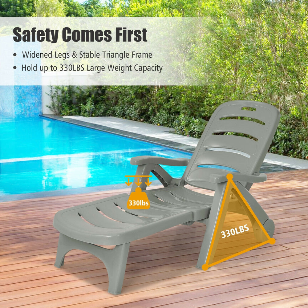 Gray 5-position adjustable folding lounger chaise chair with sturdy frame, ideal for outdoor relaxation by the poolside.