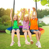 Three children joyfully playing on a 40-inch flying saucer tree swing, perfect for outdoor fun and relaxation.