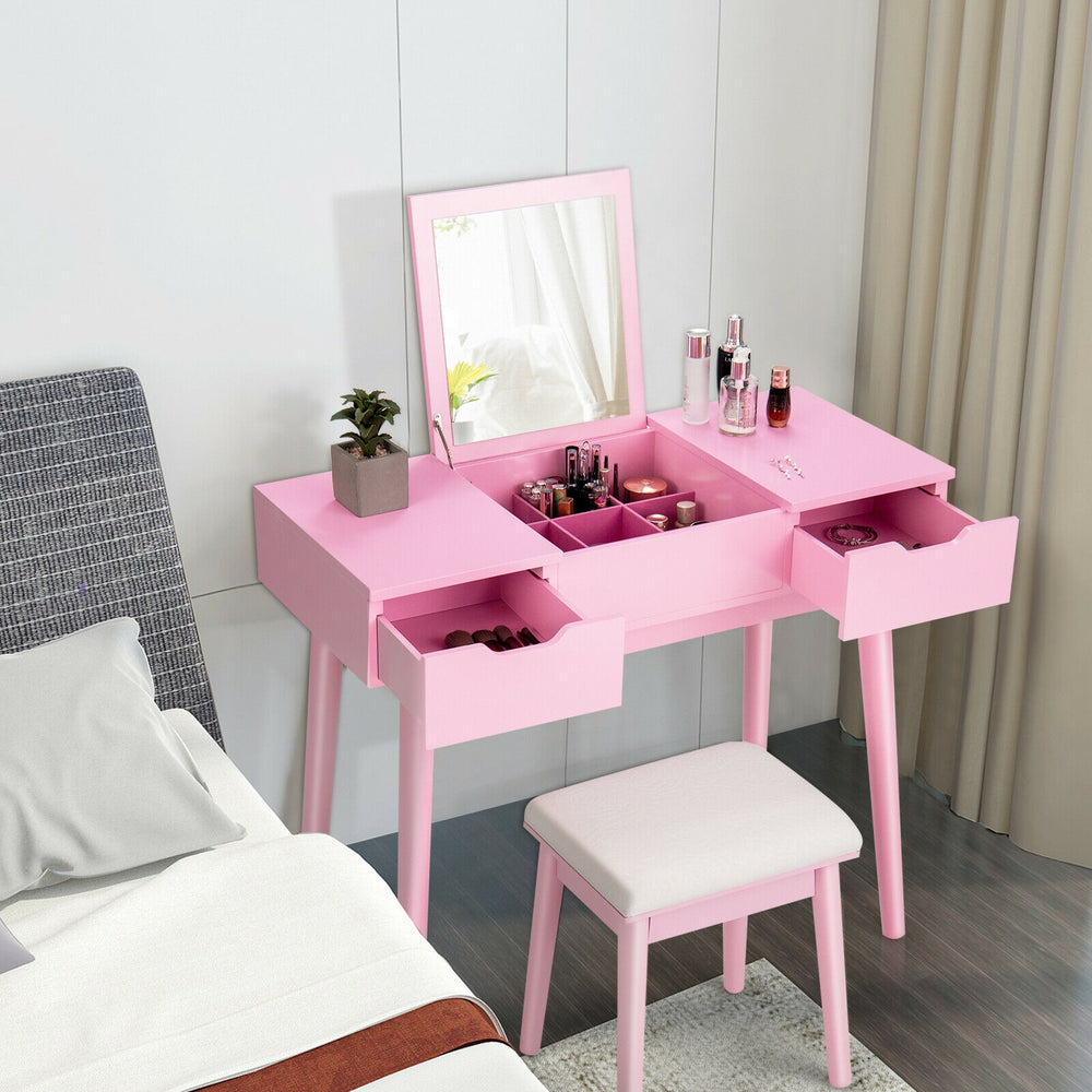 Pink makeup vanity table set with flip-top mirror, 2 drawers, and padded stool for stylish bedroom organization.