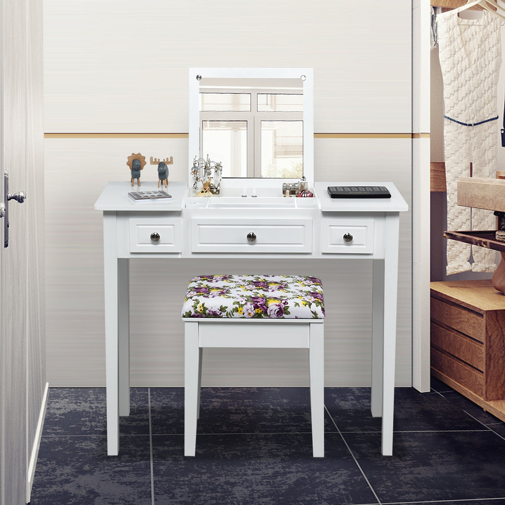 Vanity dressing table set in white with flip top mirror and three drawers, perfect for compact spaces and storage.