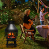 Patio wood burning chimney fireplace in a backyard setting, featuring heavy-duty cast iron and round wire mesh for.