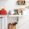 Wall-mounted folding table in white, 31.5 x 23.5 inches, perfect for small spaces and multifunctional use in any room.