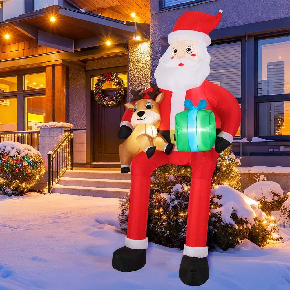 9.5 feet inflatable Santa with LED lights, holding a reindeer and gift box, perfect for outdoor Christmas decoration.