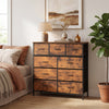 9-drawer fabric dresser with a rustic brown wooden top, styled in a cozy bedroom setting with a lamp and plant.