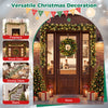 Christmas garland with 180 frosted branch tips and 50 warm white LED lights frames a festive store entrance.