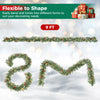 9 FT Christmas garland with frosted branches, red berries and 50 warm white LED lights for festive decorating