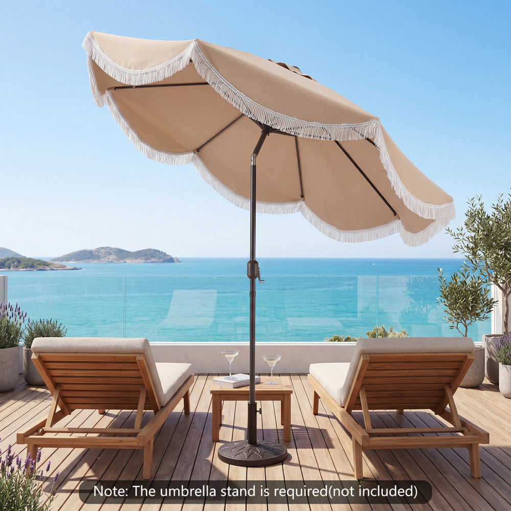 9 FT outdoor tassel umbrella with push button tilt, featuring a vented canopy for airflow, ideal for patio lounging.