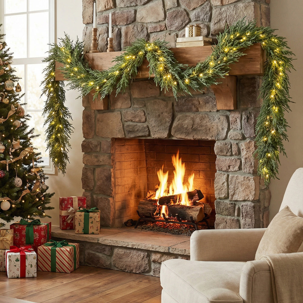 9 FT pre-lit artificial cypress Christmas garland with 50 warm white LED lights, beautifully draped and glowing above a.