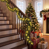 9 FT pre-lit artificial cypress Christmas garland with 50 warm white LED lights, perfect for decorating staircases.