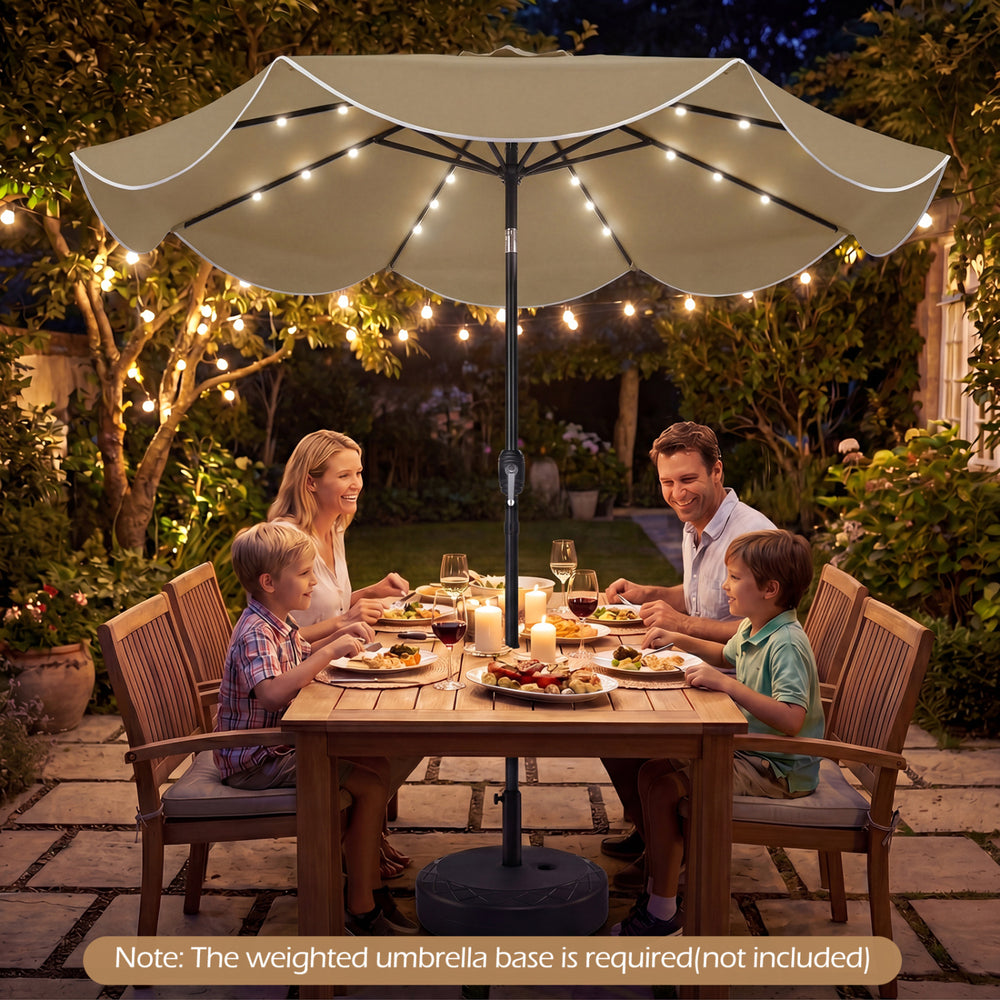 9 FT tan scalloped solar patio umbrella with 24 LED lights, providing shade and illumination for outdoor dining.