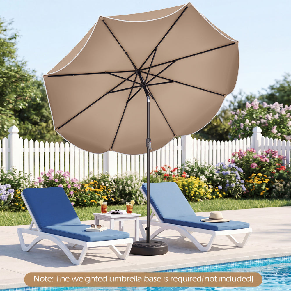 9 FT tan scalloped solar patio umbrella with 24 LED lights, shown tilted for optimal shade by the poolside.