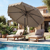 Patio umbrella with ruffled edges and weighted base, providing shade for outdoor relaxation by the pool.