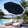 Navy 9 feet solar patio umbrella with LED lights, featuring a push button tilt for optimal shade by the poolside.