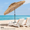 9-foot thatched tiki patio umbrella with LED lights, featuring a ventilated top for cooling, ideal for beach relaxation.