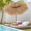 Thatched tiki umbrella with 8 ribs, 9 feet tall, providing shade by the poolside for outdoor relaxation.
