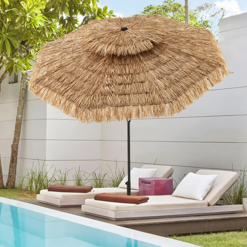 Thatched tiki umbrella with 8 ribs, 9 feet tall, providing shade by the poolside for outdoor relaxation.