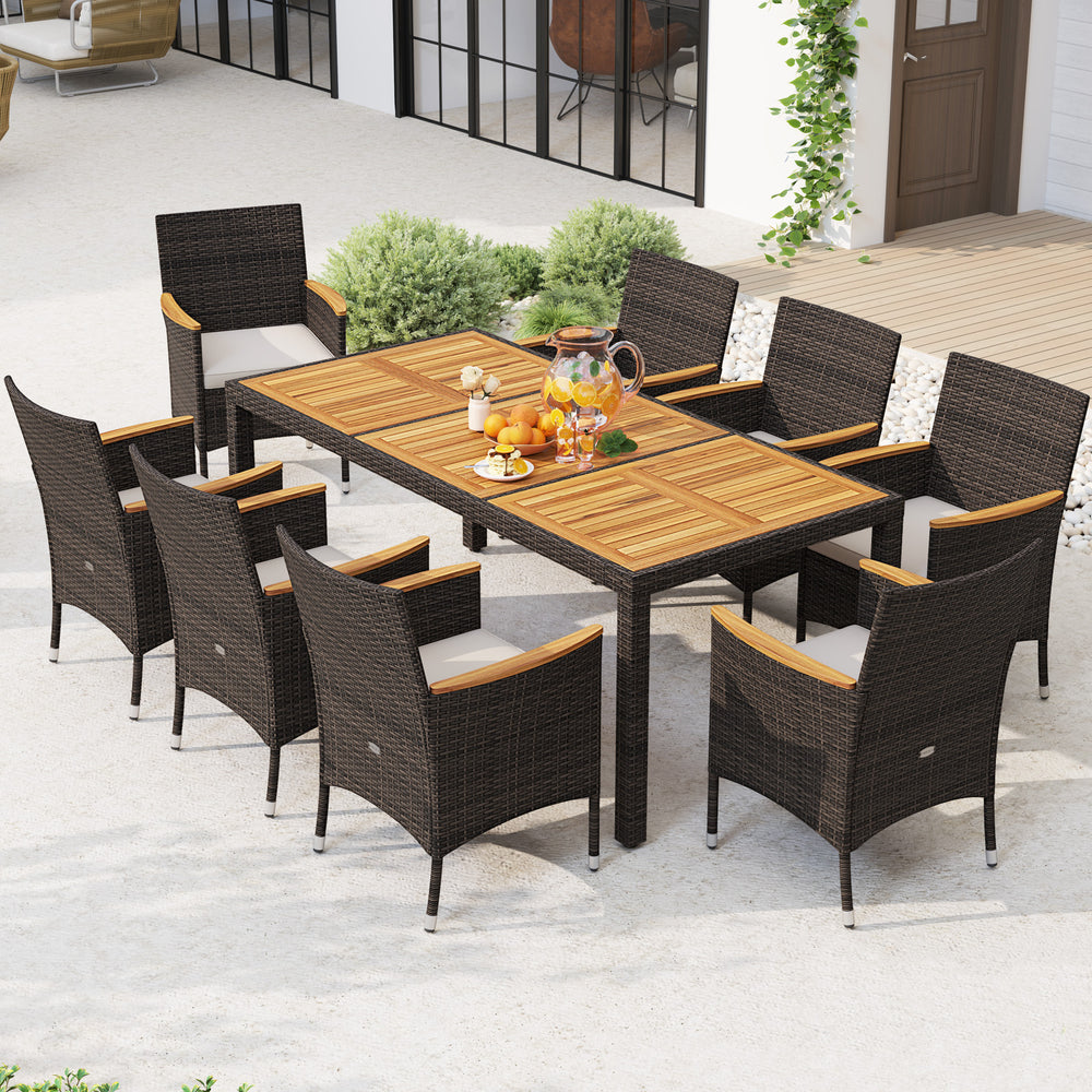 9-piece outdoor dining set featuring an acacia wood table top and beige cushioned chairs for comfortable outdoor meals.