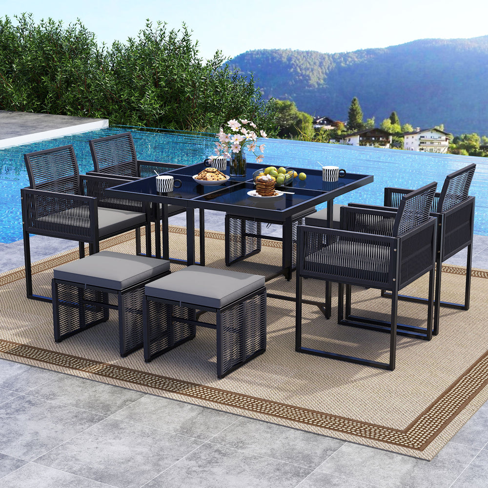 9-piece patio dining set featuring gray cushions, sturdy metal frame, and tempered glass tabletop for outdoor dining.