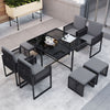 9-piece patio dining set featuring gray cushions, PE rattan chairs, and a tempered glass tabletop for outdoor.
