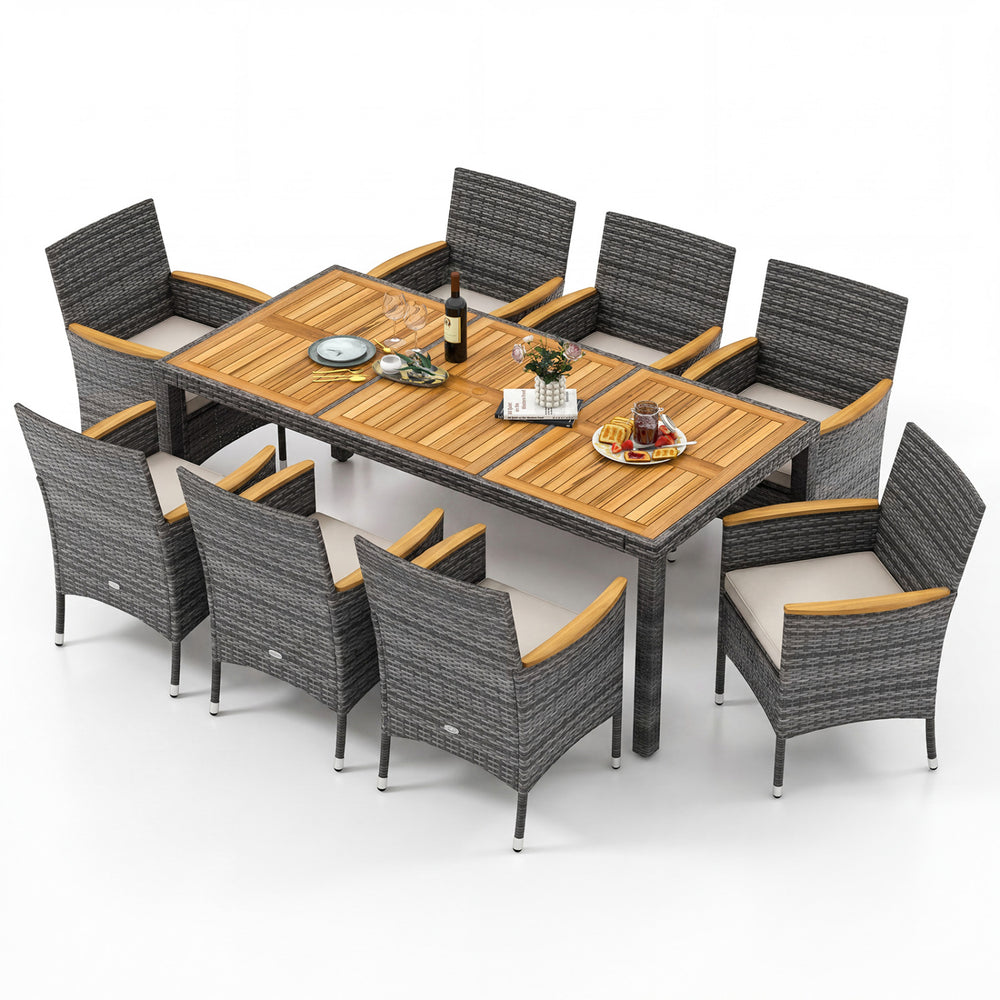 9-piece rattan patio dining set featuring an acacia wood table and cushioned chairs, ideal for outdoor gatherings.