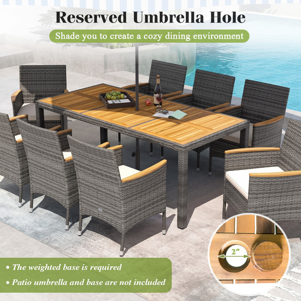9-piece rattan patio dining set featuring an acacia wood table with an umbrella hole, ideal for outdoor dining.
