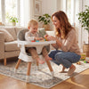 9-in-1 convertible high chair with solid wood legs, featuring a soft cushion and adjustable tray for babies and.