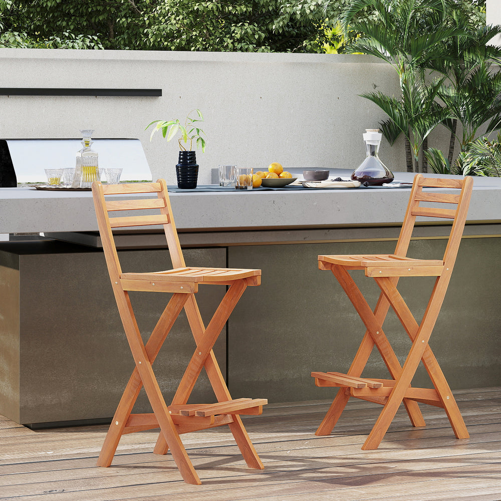 Acacia wood bar height chair with backrest and footrest, featuring a slatted design for outdoor comfort and style.