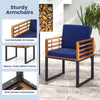 Acacia wood outdoor dining chair with navy soft cushions, sturdy metal frame, and cozy armrests for patio comfort.
