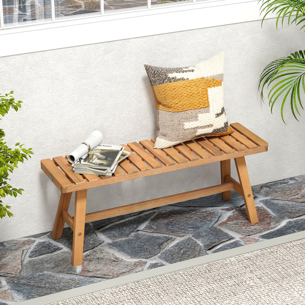 Acacia wood outdoor garden bench featuring a slatted seat and stylish natural finish, ideal for porch or balcony.