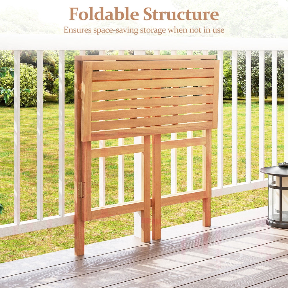 Foldable acacia wood outdoor bar table with slatted tabletop, perfect for balcony or patio space-saving storage.