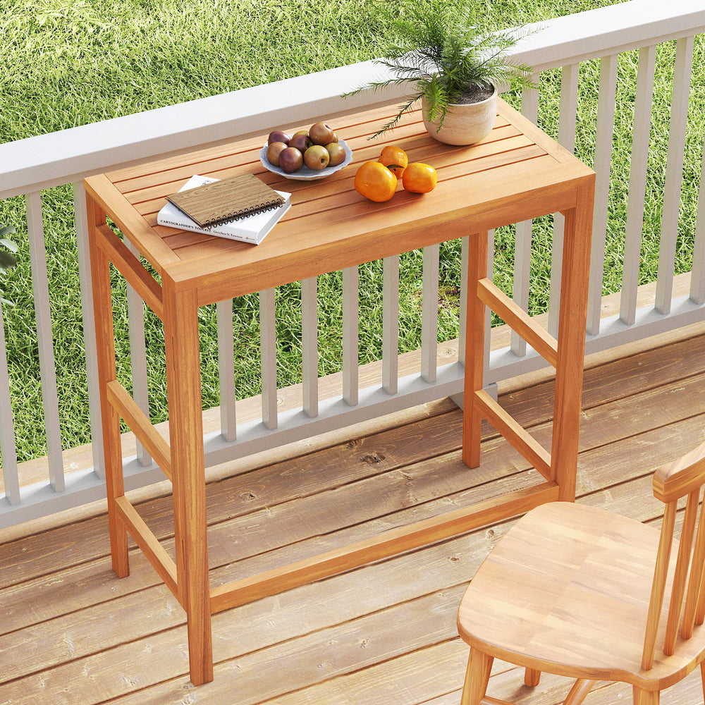 Acacia wood outdoor bar table with slatted tabletop, perfect for balconies and space-saving storage when folded.