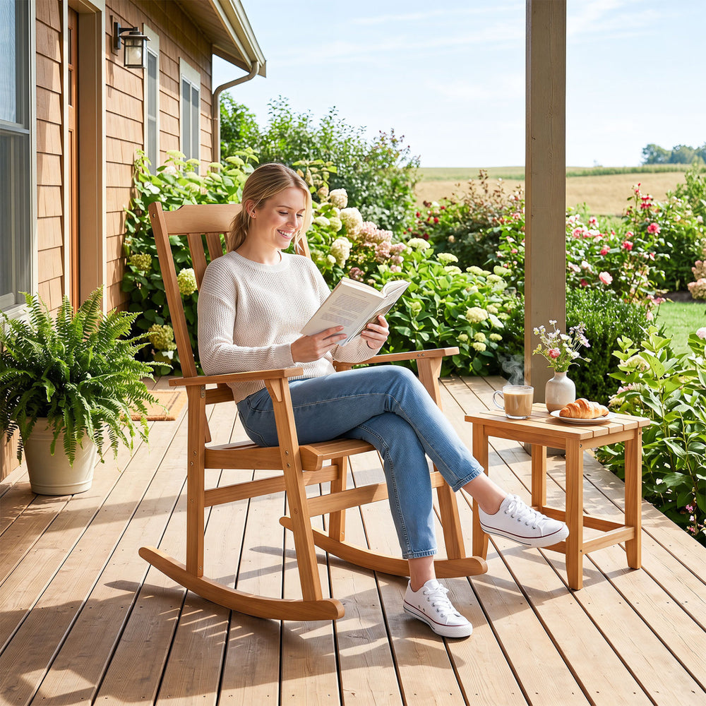 Oversized acacia wood rocking chair with high back and armrests, perfect for outdoor relaxation on porches or decks.