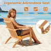 Natural acacia wood Adirondack chair with inclined backrest and wide armrests, perfect for outdoor patio relaxation.