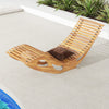 Acacia wood patio rocking sun lounger with ergonomic curved seat, perfect for poolside relaxation.