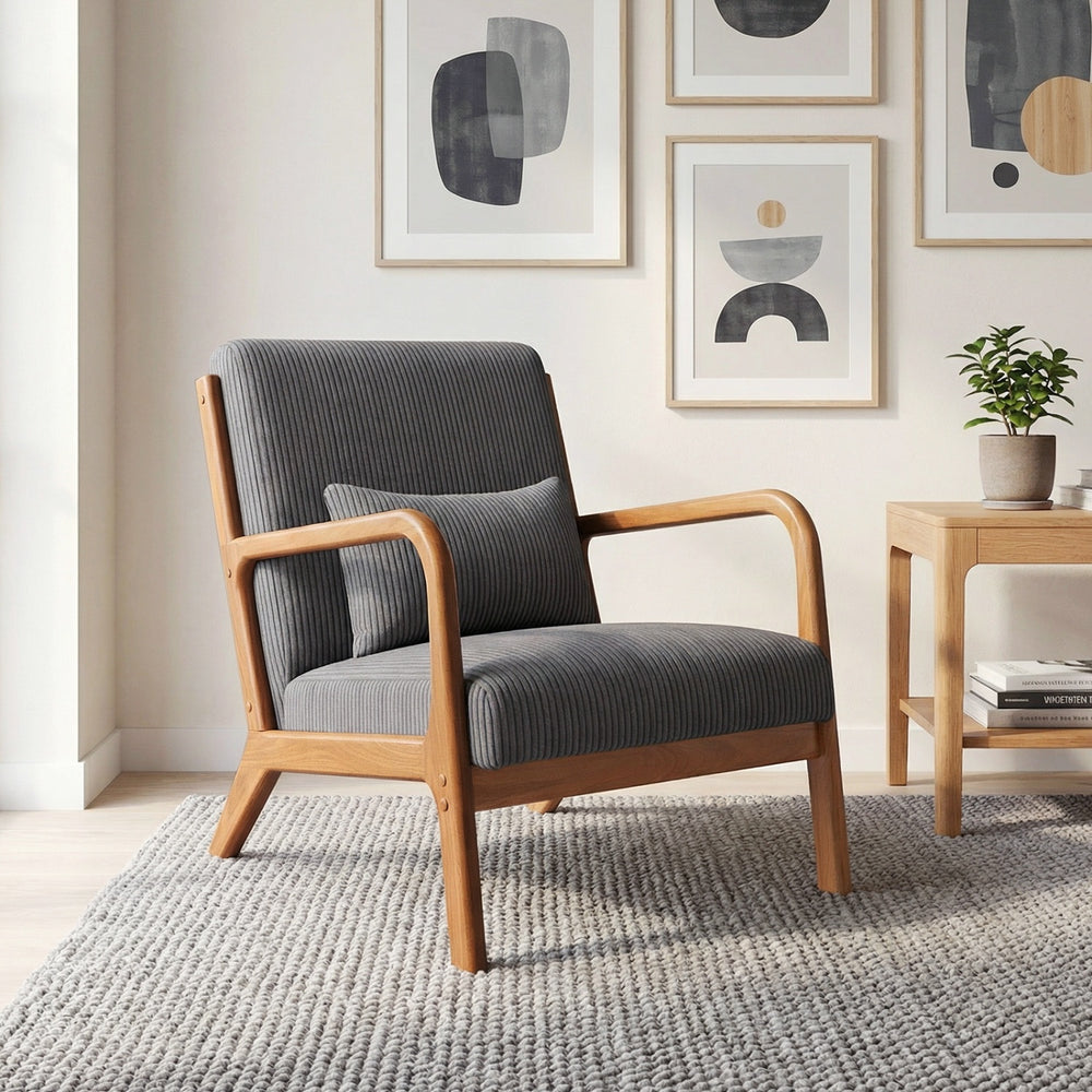 Gray corduroy accent chair with lumbar pillow, solid wood frame, perfect for living rooms and home offices.