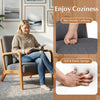 Accent chair with gray corduroy upholstery, lumbar pillow, and solid wood frame, ideal for cozy living room seating.