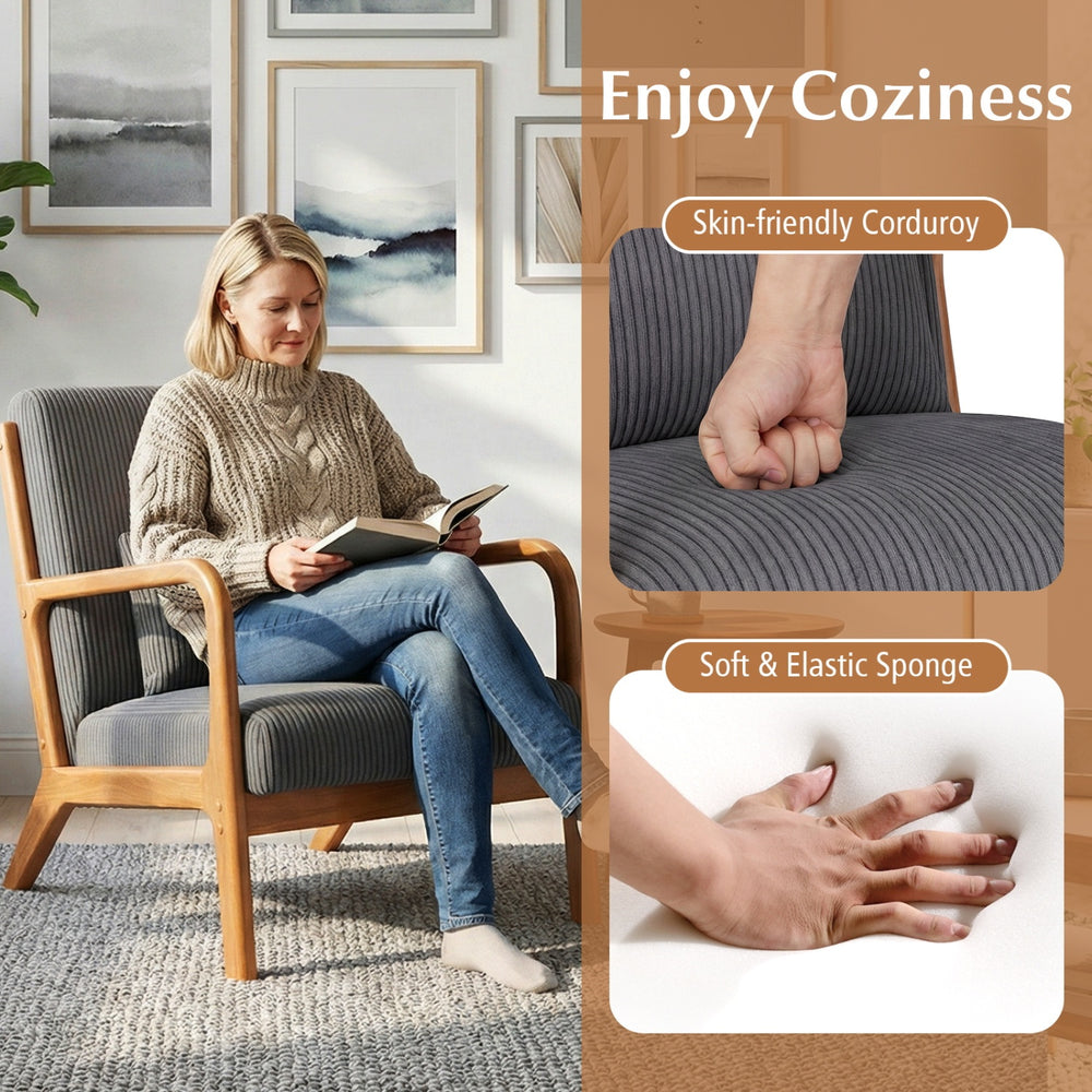 Accent chair with gray corduroy upholstery, lumbar pillow, and solid wood frame, ideal for cozy living room seating.