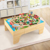 Wooden train set with reversible tabletop, featuring 84 pieces, gas station, and helicopter pad for imaginative play.