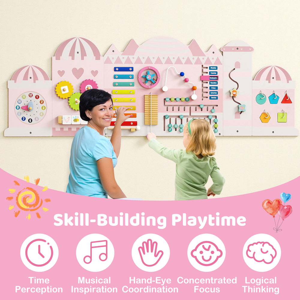 Wooden sensory busy board for toddlers featuring a pink castle design, promoting fine motor skills and time perception.