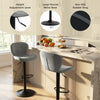 Adjustable gray velvet counter height chair with 360° swivel and round metal base, ideal for home bars and dining rooms.