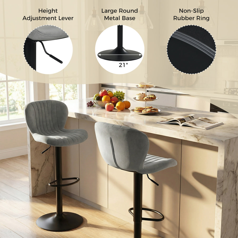 Adjustable gray velvet counter height chair with 360° swivel and round metal base, ideal for home bars and dining rooms.