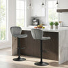 Adjustable gray velvet counter height chairs with 360° swivel and round metal base, ideal for modern dining spaces.