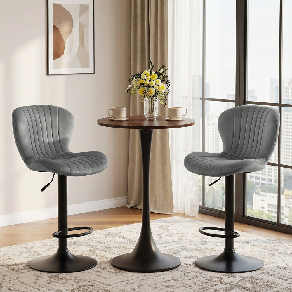 Adjustable gray velvet counter height chairs with 360° swivel and round metal base, ideal for home bars or dining rooms.